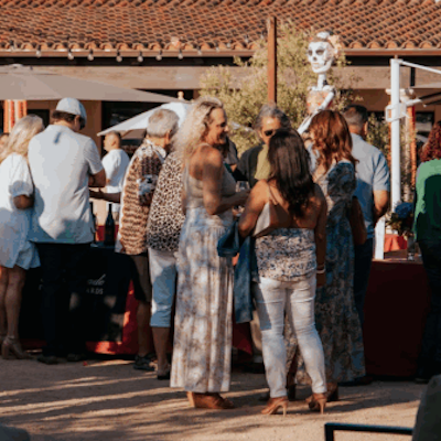 women drinking wine at an event