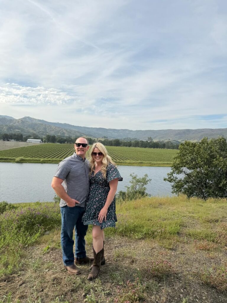 people smiling in vineyard